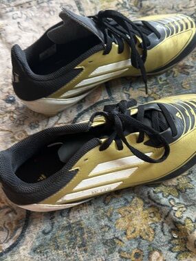 adidas Black and Gold Soccer Cleats with White Stripes
